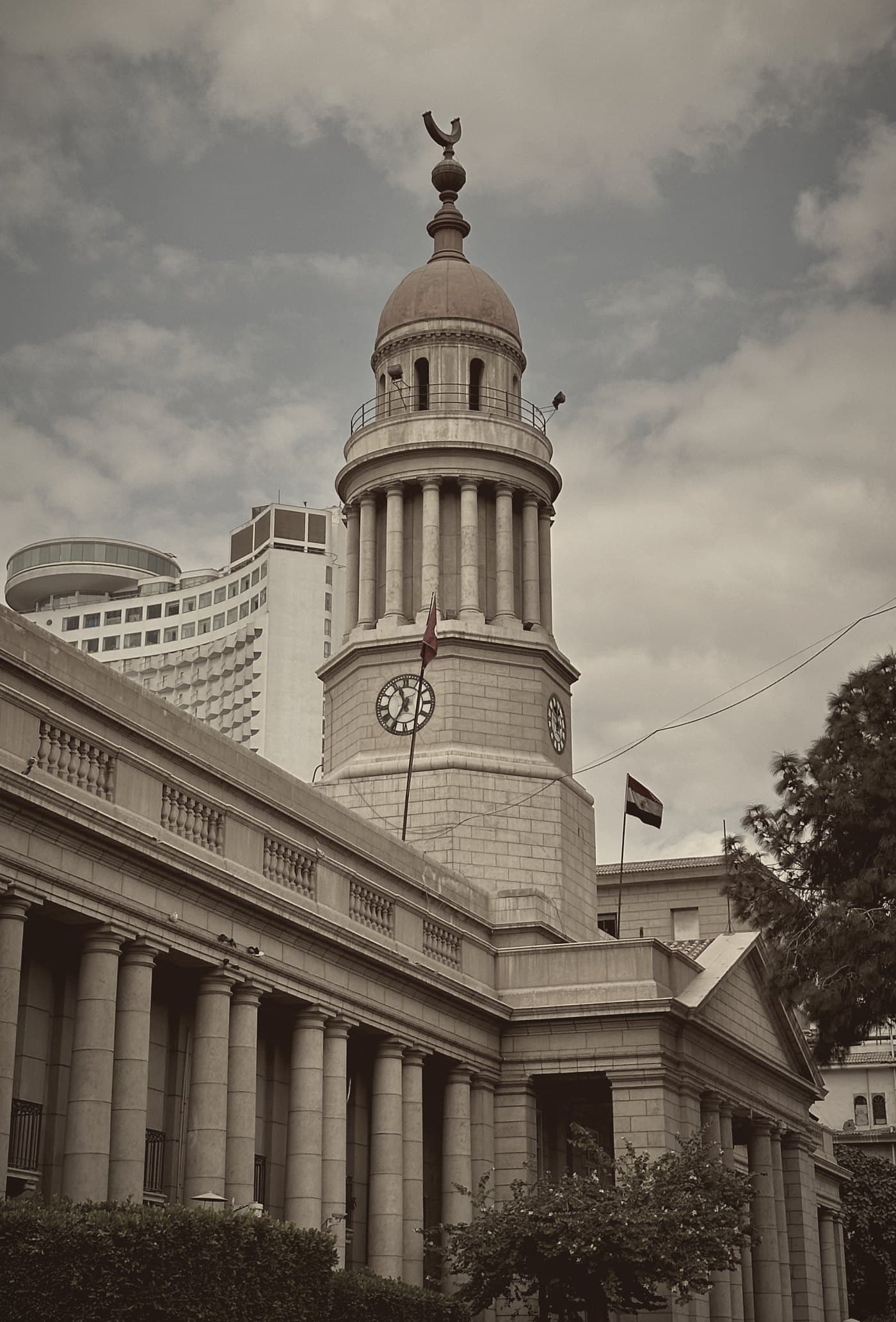 The colonnade and the clock tower of Kasr Al-Ainy under clouds